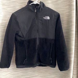 A north face black jacket. A girls Medium